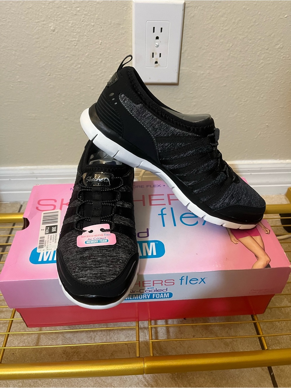 Skechers Women's Black and White Slip-On Athletic Sneakers